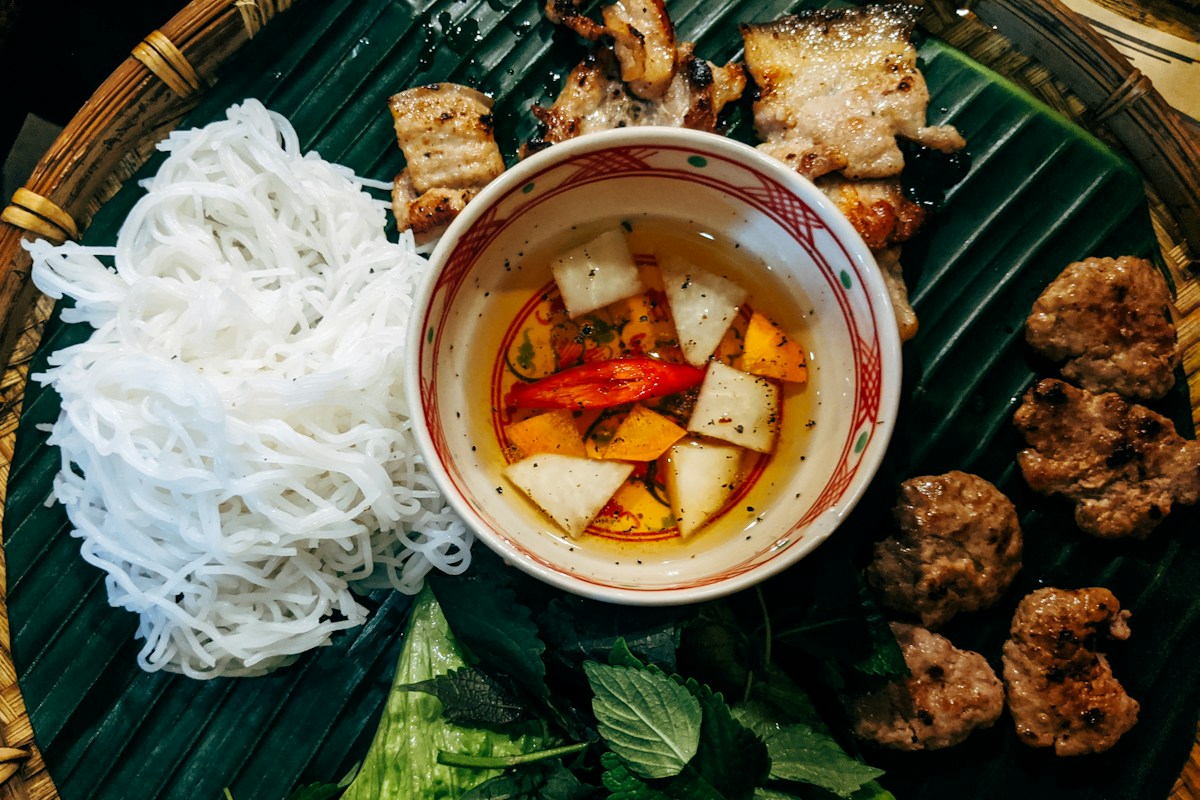Grilled pork and meat patties with rice vermicelli and dipping sauce